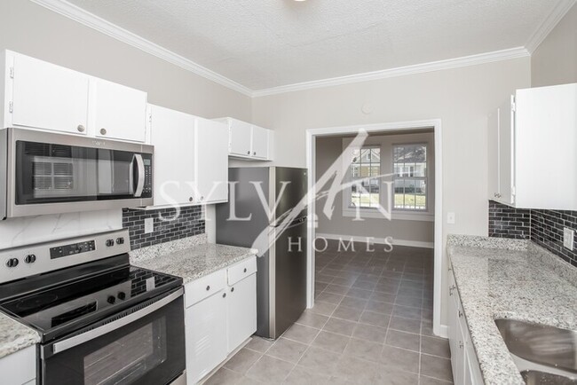 Building Photo - The living is easy in this 3 bedroom, 1 ba...