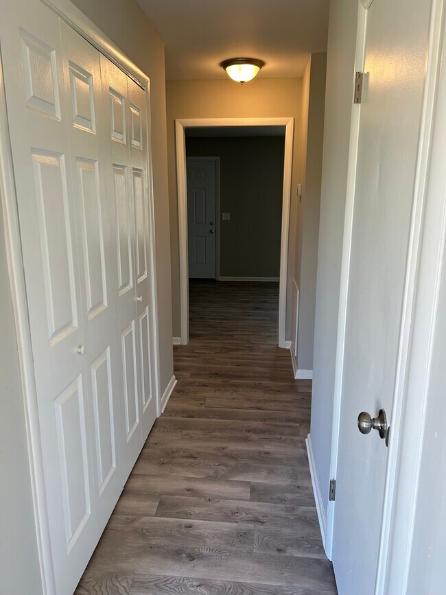 hall with closets and utility room - 810 Lillard Rd