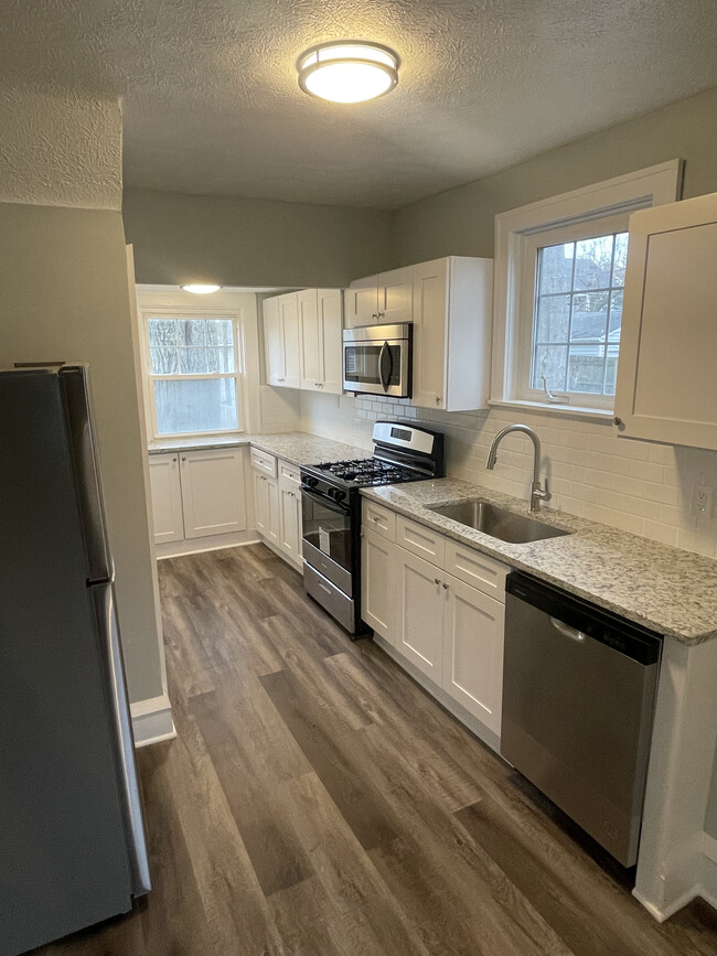Brand new kitchen with lots of granite counterspace, no-slam cabinets and new stainless appliances - 3377 Silsby Rd