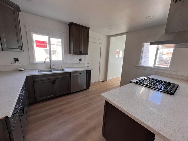 Building Photo - FULLY REMODELED 2BR/1BA home w/ parking an...