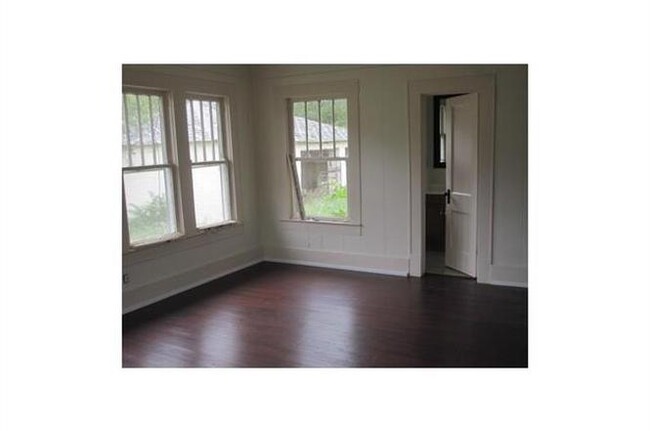 Bathroom is off the living-room/bedroom area. Bathroom has a corner shower, toilet and small vanity. - 701 W 9th St