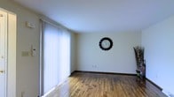 Located at 3451 E Livingston Ave in Columbus, Ohio, this multi-level property spans three floors, offering generous living space across a well-organized layout. The interior showcases warm hardwood flooring throughout, adding a timeless character to the home. Large windows dressed with vertical blinds allow abundant natural light to flow into the living areas, creating a bright and welcoming atmosphere. The clean, neutral-toned walls provide a versatile backdrop, making it easy to personalize each room. The living space is open and airy, with smooth ceilings and classic dark baseboards that frame the hardwood floors with a refined contrast. The three-floor layout offers ample room for distinct living, sleeping, and utility areas spread across separate levels, providing both functionality and privacy. Overall, the property presents a straightforward and practical design with quality finishes, well-maintained surfaces, and a comfortable ambiance suited for everyday living in an established Columbus neighborhood.