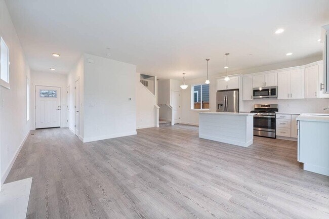 Living room and kitchen w/view of front door - 1801 Allen Rd SE