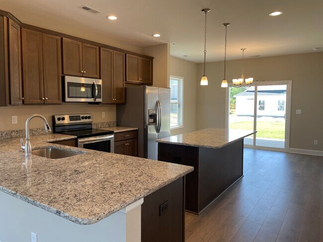 Building Photo - Welcome to this stunning 4-bedroom, 3-bath...