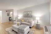 Located at 7601 Black Lake Rd in Kissimmee, Florida, this single-floor unit offers a thoughtfully arranged layout that maximizes functionality within a compact footprint. The living area serves as the centerpiece of the space, featuring light wood-style flooring, crisp white walls, and crown molding that adds a clean, finished look throughout. Large windows allow generous natural light to fill the room, creating an airy and welcoming atmosphere. The open layout connects the living area seamlessly to a small dining nook, which includes a glass-top table and is situated adjacent to a closet for convenient storage.

The kitchen is efficiently designed with white cabinetry, light stone-toned countertops, a deep double stainless steel sink, and stainless steel appliances including an electric range and over-the-range microwave. Under-cabinet lighting enhances both functionality and ambiance.

The bathroom features a striking dark granite vanity countertop with a large framed mirror, wood-look tile flooring, and a tub-shower combination, offering a polished and practical finish. The overall aesthetic throughout the space is neutral and contemporary, creating a clean, cohesive environment well-suited to comfortable everyday living.