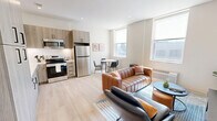 Located in Pittsburgh's South Side neighborhood, this one-bedroom, one-bathroom residence at 2024 Jane St offers a thoughtfully designed open-concept layout with modern finishes throughout. Light hardwood flooring flows seamlessly across the entire unit, creating a cohesive and airy aesthetic.

The kitchen is a standout feature, outfitted with light wood cabinetry extending to the ceiling for ample storage, white countertops, and a full suite of stainless steel appliances including a range, microwave, dishwasher, and refrigerator. The kitchen opens directly into the dining and living areas, making the space ideal for everyday living and casual entertaining.

The living room benefits from a large window that draws in natural light and features clean white walls, recessed lighting, and an efficient, comfortable layout. The bedroom is a well-proportioned retreat with a window for natural light, light-toned hardwood floors, and neutral walls that create a calm atmosphere.

The bathroom is finished with a sleek sliding glass walk-in shower, wood-toned vanity with modern black hardware, recessed lighting, and wood-look flooring that ties together the unit's contemporary design language. This unit delivers a clean, modern living experience in a compact and efficient floor plan.