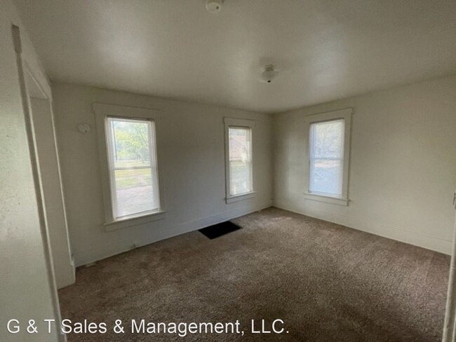 Building Photo - 4 br, 1.5 bath House - 710 W. Church