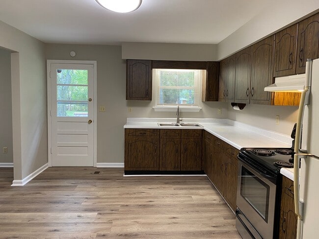 Kitchen sink/back door leads to deck - 743 Cloud Springs Rd