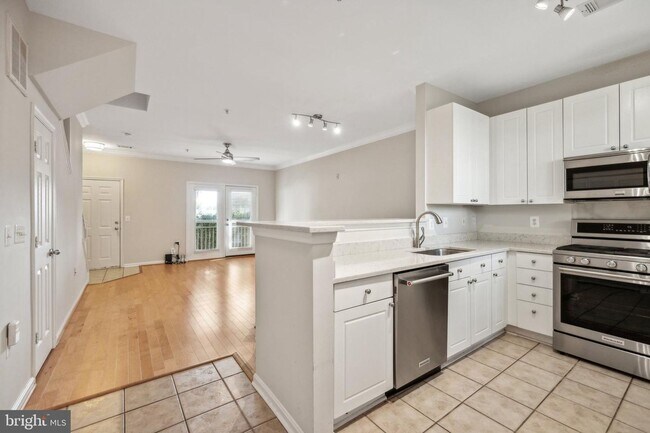 Building Photo - This townhouse style condo is located across the street from the Vienna Metro Station (Orange Line).