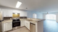 Located at 812 Crescent Commons Way in Fayetteville, NC, this single-floor residence offers a well-organized layout with modern updates throughout. The kitchen is a standout feature, showcasing white shaker-style cabinetry, granite countertops, a subway tile backsplash, and a full suite of stainless steel appliances including a refrigerator, electric range, and dishwasher. Light wood-style flooring runs through the kitchen and flows into a spacious open living area, which is bathed in a clean, neutral palette and connects seamlessly to the rest of the home through arched doorways. The bedrooms are carpeted for comfort and each includes a ceiling fan with light fixture and window blinds that allow for natural light and outdoor views. The hallway leads to a dedicated laundry area with side-by-side washer and dryer hookups, as well as closet storage. The bathrooms are outfitted with soaking tubs and shower combinations, complemented by granite vanity tops and white cabinetry. Overall, the home presents a bright, move-in-ready atmosphere with consistent finishes, practical storage solutions, and a comfortable, functional floor plan suited for everyday living.