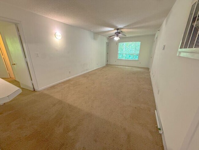 Building Photo - Top floor 4 bed 4 bath condo! On Wolfline, perfect for roommates!