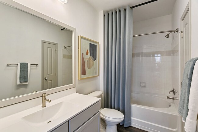 Bathroom upgrades include luxury vinyl plank flooring, framed mirrors and brushed nickel hardware - Chancery Village