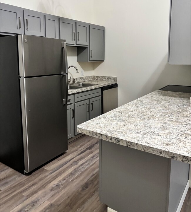 Cocina tipo loft de un dormitorio - Plum Brook Villas West