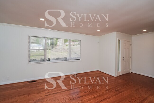 Building Photo - The living is easy in this 4 bedroom, 3 ba...