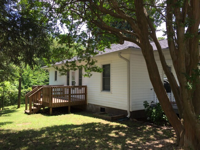 Side deck now has fence in front to enclose yard completely and allow for easy come-n-go pet access. - 1202 E. Catawba St.
