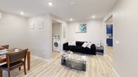 Located at 612 Hazard Ave in Enfield, Connecticut, this efficiently designed single-floor home offers three bedrooms, two full bathrooms, and a thoughtful layout that maximizes every square foot. Light-toned luxury vinyl plank flooring flows throughout the main living areas, creating a clean and cohesive aesthetic.

The living room is bright and open, featuring recessed lighting and a neutral palette that lends itself to a variety of design styles. Adjacent, the dining area accommodates a full-sized table and benefits from natural light through a window fitted with zebra-style roller blinds. The kitchen is a standout space, dressed in bold royal blue cabinetry with black hardware, white subway tile backsplash, white quartz countertops, and stainless steel appliances including a dishwasher — all illuminated by under-cabinet LED lighting.

Each bedroom is well-proportioned, with the primary bedroom featuring dual windows and ample natural light. All bedrooms include wall-mounted mini-split units for individualized climate control. The two bathrooms are finished with striking marble-style tile walls, wood-look tile flooring, and black fixtures, one featuring a soaking tub/shower combination. A dedicated laundry room with a full-size washer and dryer adds everyday convenience to this move-in-ready home.