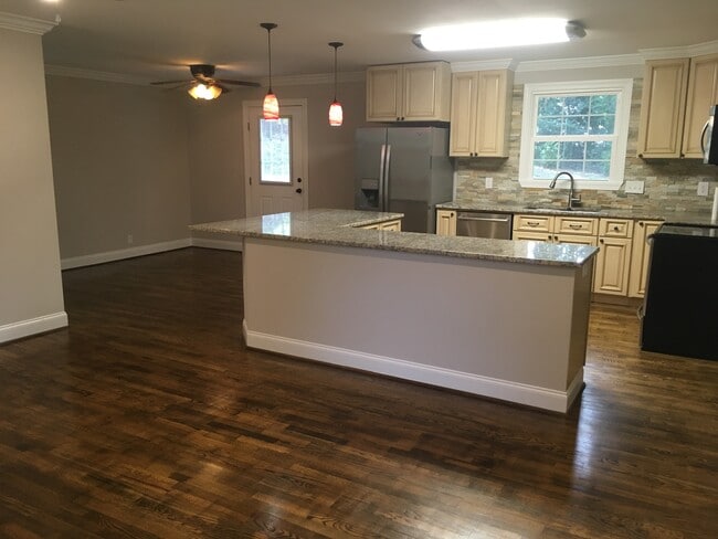 Open kitchen, dining, living area - 4922 Baylor Dr
