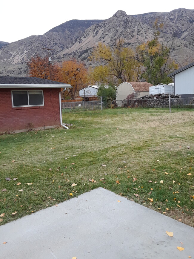 large yard partially fenced. - 638 N 400 E
