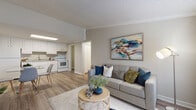 Located at 2909 Burroughs Dr in Pine Hills, Florida, this single-floor residence offers a well-designed layout that balances comfort and functionality. The open-concept living area is anchored by wood-look flooring, crown molding, and large windows that invite natural light throughout the space. The living room provides a welcoming atmosphere with ample room for seating and entertainment, flowing seamlessly into the kitchen. The kitchen is outfitted with crisp white cabinetry, granite-style countertops, a stainless steel sink, and white appliances including a range and refrigerator, all illuminated by a overhead skylight panel. The bedroom is generously proportioned, featuring wood-look flooring, a ceiling fan, crown molding, and a dedicated closet. The full bathroom is finished with a white vanity topped with granite-style counters, wood-look flooring, and a tub-shower combination. A dedicated laundry room provides added convenience with space for a full-size washer and dryer. Neutral tones and consistent finishes are carried throughout, creating a cohesive and move-in-ready environment suited for comfortable everyday living.