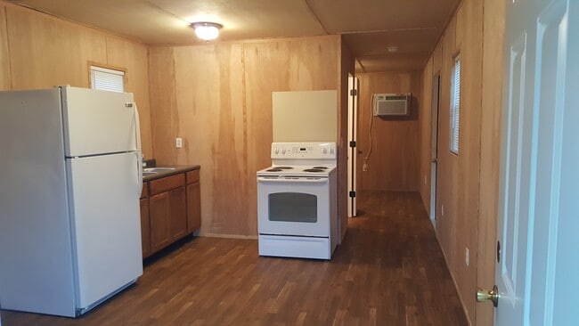 Full kitchen, hallway leading to bed and bath. - 4182 FLOYD JOHNSTON RD