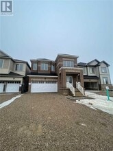 Building Photo - 404 Black Cherry Cres