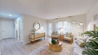 This 2-bedroom, 2-bathroom residence in Greensboro, NC offers a thoughtfully designed single-floor layout that maximizes comfort and functionality. The living room is bright and welcoming, featuring light hardwood-style flooring, a textured ceiling, and a glass-paneled door that invites natural light to fill the space. Adjacent to it, the dining area is anchored by a stylish chandelier overhead and flows seamlessly into the rest of the common areas. The kitchen is well-equipped with white cabinetry, stainless steel appliances including a range, microwave, and dishwasher, complemented by light countertops and a tile backsplash. The primary bedroom offers a cozy, neutral palette with closet space and natural light from a window with blinds. The second bedroom features carpet flooring, a ceiling fan, and its own window. Both bathrooms are clean and functional, with one featuring a tub-shower combination. Throughout the home, a warm, neutral color scheme and light flooring create a cohesive and inviting ambiance, making this residence a comfortable and practical living space in the heart of Greensboro.