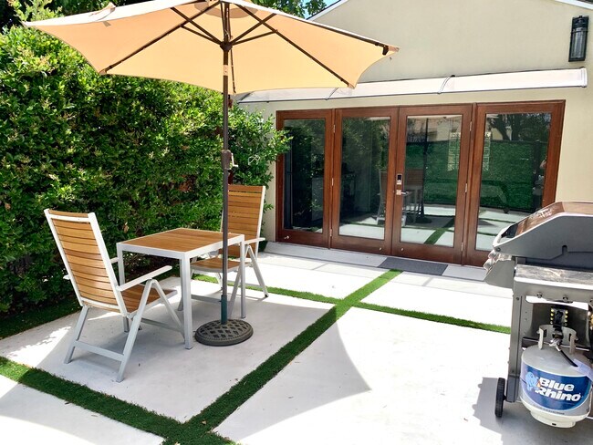 Private garden patio with motion sensor lights. - 5939 Vesper Ave