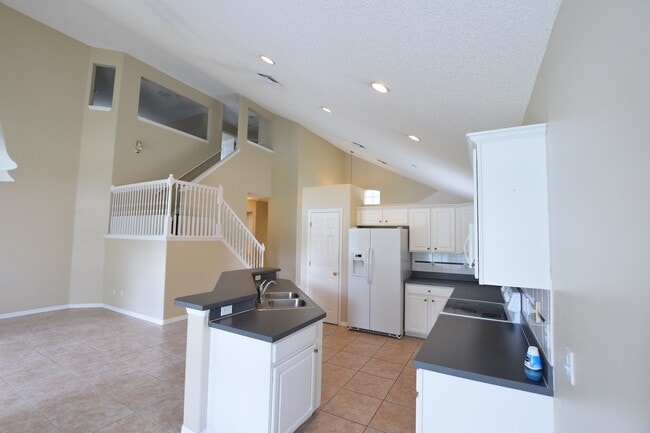 Building Photo - AMAZINGLY SPACIOUS 4-Bedroom Home with Loft in Gated Northshore at Lake Hart – Golf, Tennis & Lak...