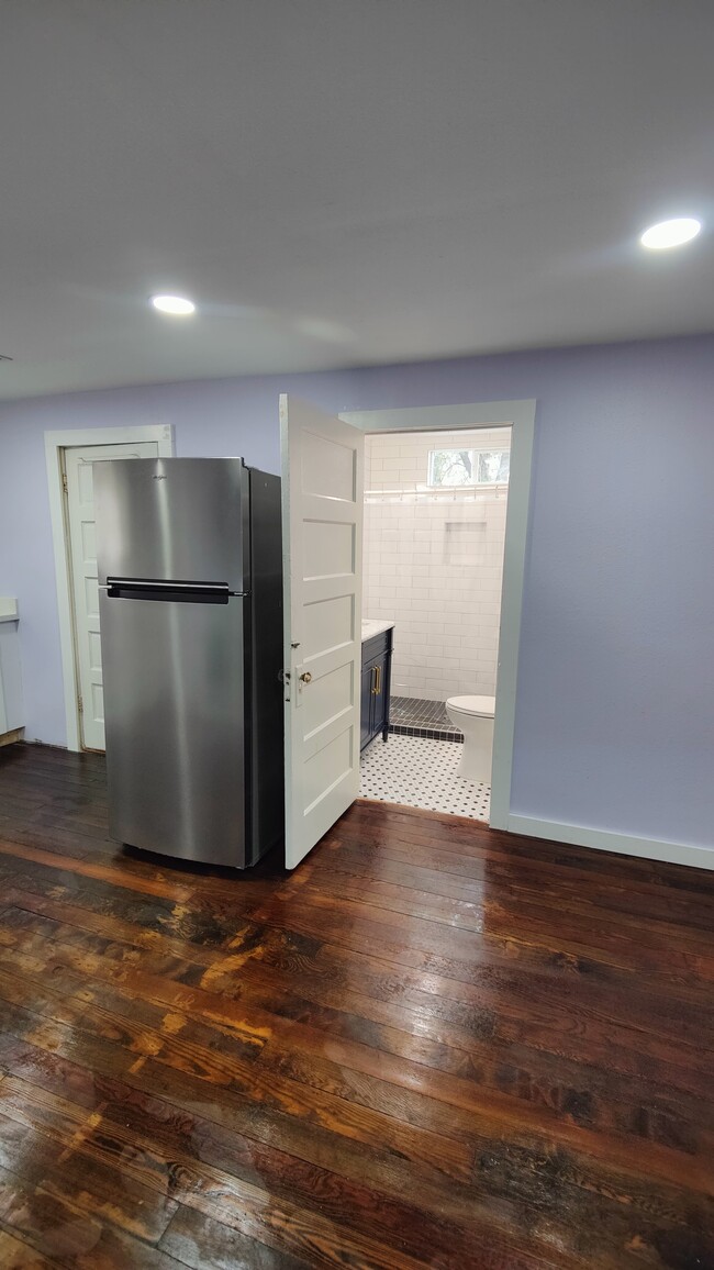 Kitchen Looking into Bathroom - 115 Amundsen St