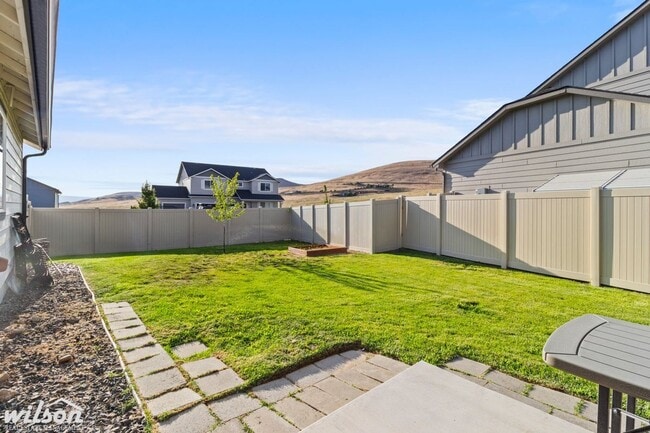 Building Photo - Welcome Home: Big Yard, Garage, and Pets A...
