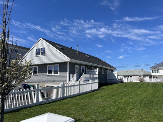 Outside view of the home. Fenced in yard. - 32 Campton St