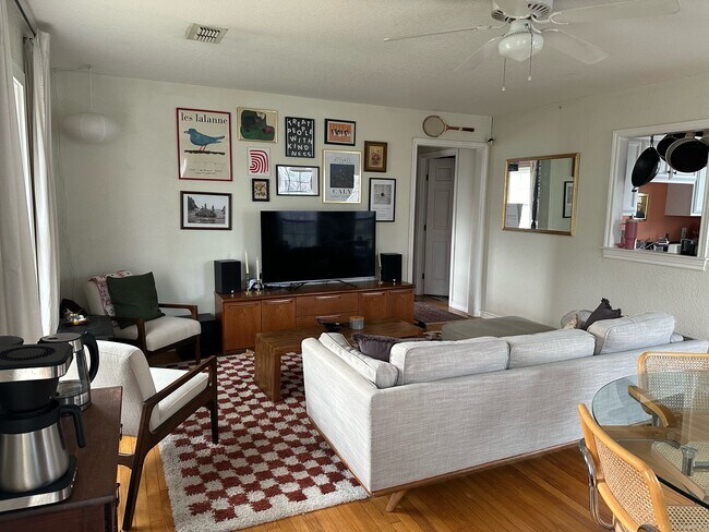 Living room. 940-383-2500 - 2019 N Bell Ave