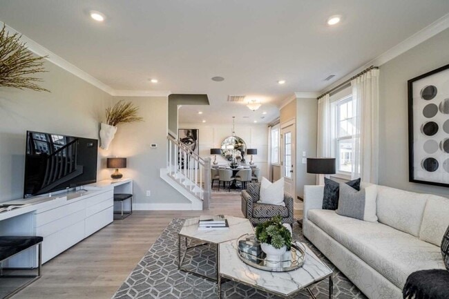 Building Photo - 3 Bedroom 2.5 Bathroom End Unit Townhome w/ 1st Floor Owners Suite and a 2 car Garage in the hear...