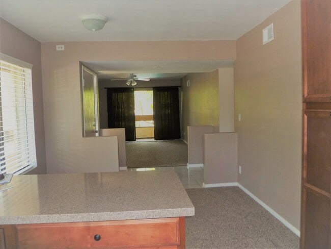 Kitchen looking into dining room, family room and balcony - 8438 Summerdale Rd