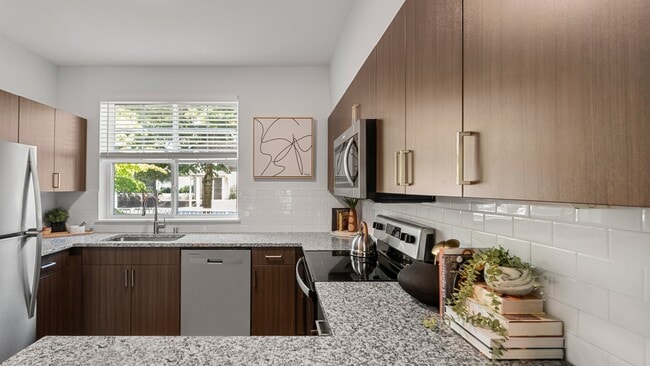 Modern open-concept layouts create a seamless flow between kitchen and living spaces - The Timbers at Issaquah Ridge