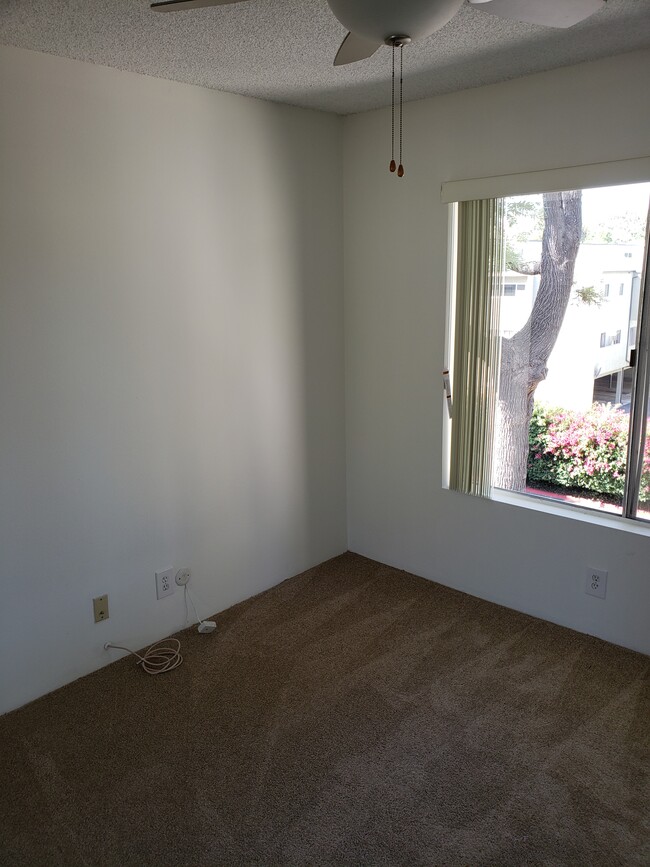 Reverse view of second bedroom on the main floor - 2312 Summertime Ln