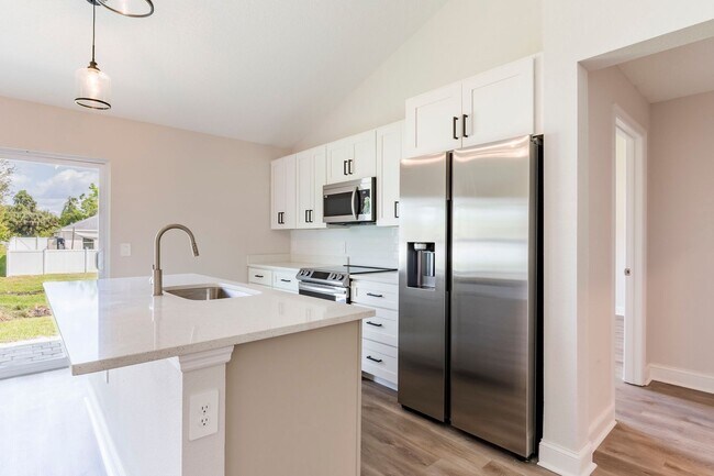 Building Photo - WATER & SOLAR INCLUDED - BRAND NEW 3 bed /...
