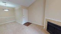 This single-story, 2-bedroom, 2-bathroom residence offers a thoughtfully designed layout spread across a comfortable footprint. The living area features vaulted ceilings that enhance the sense of openness, neutral beige walls, plush carpeting, and a tiled fireplace, creating a welcoming atmosphere. A ceiling fan and pendant light fixture provide both function and style, while a pass-through shelf connects the living space to adjacent areas.

The galley-style kitchen is equipped with warm wood cabinetry, granite-style countertops, hardwood-style flooring, and black appliances including a refrigerator, dishwasher, and range. It opens conveniently toward the main living and dining areas.

Both bedrooms are carpeted and finished in neutral tones, with each room receiving natural light through window blinds. The primary bedroom includes a ceiling fan, dual windows, and access to a bathroom with a granite-topped vanity, wood cabinetry, hardwood-style flooring, a walk-in closet, and louvered cabinet doors. The second bathroom mirrors this aesthetic with a tub/shower combination, granite vanity, and hardwood-style flooring. The overall ambiance is clean, functional, and move-in ready.