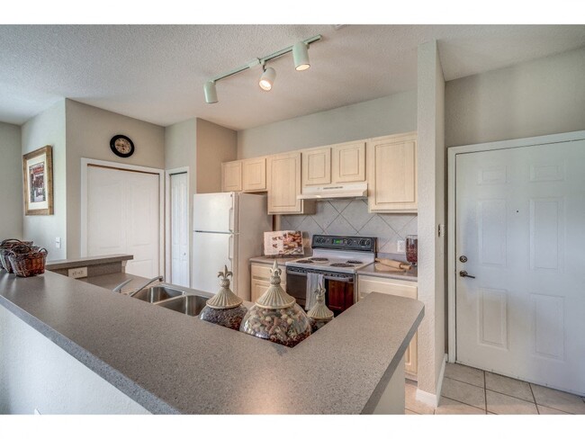 Furnished Model apartment kitchen area - Sanctuary at Highland Oaks