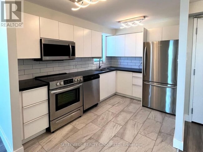 Photo du bâtiment - 1440 Heron Rd