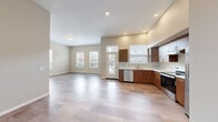 Located at 375 Osprey Ln in Independence, Oregon, this single-floor, 3-bedroom, 3-bathroom residence offers a well-designed layout with a clean, contemporary aesthetic throughout. Light-toned luxury vinyl plank flooring flows seamlessly across the entire space, complemented by neutral warm-beige walls and recessed lighting that create a bright, welcoming atmosphere.

The open-concept living, dining, and kitchen area forms the heart of the home. The kitchen is well-appointed with rich walnut-toned cabinetry, white countertops, stainless steel appliances including a dishwasher and electric range, and a window above the sink that brings in natural light. The expansive living and dining area extends generously, with multiple windows overlooking the surrounding neighborhood.

Three well-proportioned bedrooms each feature windows with views of outdoor greenery, providing natural light and ventilation. The primary bedroom includes its own dedicated closet, while five closets total throughout the residence offer abundant storage. Each of the three bathrooms maintains the same cohesive design language, featuring walnut cabinetry with white countertops and tile-style flooring. A dedicated laundry area and a private balcony round out the functional amenities of this thoughtfully designed home.