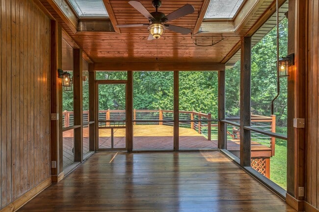 Screened in porch overlooking a private backyard. - 921 Wilson Blvd
