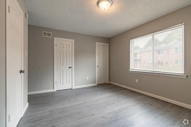 3BR, 2BA - 1100SF - Primary Bedroom - Camelot Manor