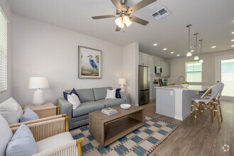 A5 1BR, 1BA - 712SF - Living Room and Kitchen - The Eleanor at Daytona Beach