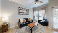 Located at 2810 Hemphill Park in Austin, TX, this 2-bedroom, 3-bathroom single-floor residence offers a well-organized and functional layout. The living room features crown molding, tile flooring, a ceiling fan, and a large window that allows natural light to fill the space. The kitchen is equipped with light wood cabinetry, granite countertops, stainless steel appliances, and tile flooring, and it opens to a dining area with a breakfast bar seating two. The primary bedroom is generously sized, with plush carpeting, a ceiling fan, natural light from a window with blinds, and a walk-in closet with built-in shelving. It includes a private en-suite bathroom with a glass-enclosed shower. The second bedroom is similarly appointed with carpet flooring, a ceiling fan, and its own en-suite bathroom featuring a vanity with a large mirror and a shower. A third bathroom is also available for guests. Both bedrooms include dedicated closet space. The unit also includes an in-unit laundry area for added convenience. Throughout the home, neutral tones, crown molding accents, and consistent tile flooring in common areas contribute to a cohesive and comfortable living environment.