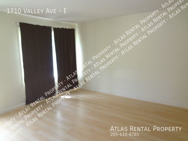 Building Photo - "Charming Homewood Townhouse: Bright, Spac...