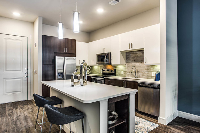 Coveted finishes including quartz countertops, tile backsplashes and upgraded fixtures - Windsor by the Galleria