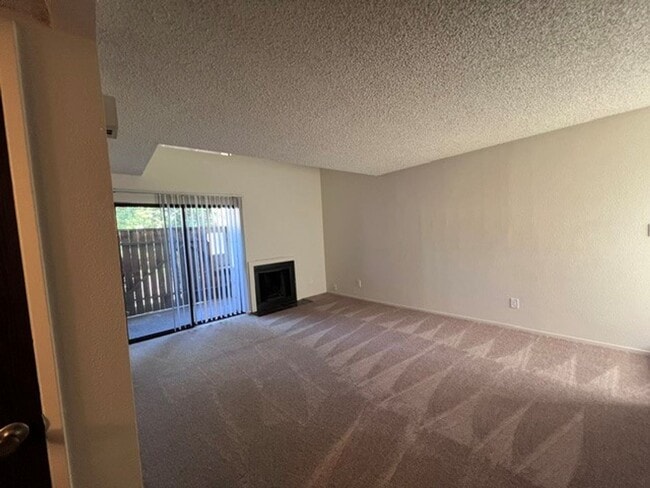 Building Photo - Freshly painted condo with new carpet in gated community.