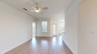 This contemporary 1060 square foot apartment in Orlando, Florida, offers a harmonious blend of style and functionality. The single-story layout encompasses two bedrooms, including a spacious 160 square foot primary bedroom, and two full bathrooms. The heart of the home is an open-concept living area, seamlessly integrating the kitchen and living room. The kitchen is a chef's dream, boasting pristine white cabinetry, stainless steel appliances, and a sleek design that maximizes efficiency. Large windows throughout flood the space with natural light, creating an airy and inviting atmosphere. The flooring alternates between warm wood-look planks in the main living areas and plush carpeting in the bedrooms, adding comfort and visual interest. Each bathroom features modern fixtures and ample storage. The apartment also includes three closets, ensuring plenty of storage space. Ceiling fans in the bedrooms provide additional comfort. The overall design aesthetic is clean and minimalist, with a neutral color palette that allows for personalization. This well-designed apartment offers a perfect balance of comfort and style in a prime Orlando location.