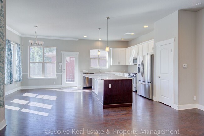 Building Photo - Evolve Real Estate: Modern Comfort Meets D...